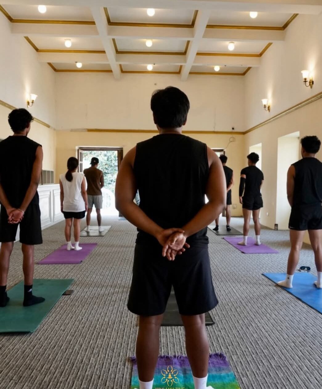 Instructor leading a standing class for a team